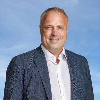 Mogens Hansen, ATN Service aps. Smilende mand i blå jakke, repræsenterer rekrutteringsfirma for vikarer.